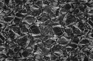 Black and white abstract background with texture and noise.