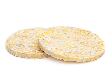 Two pieces of round diet rice bread on white. Healthy eating.