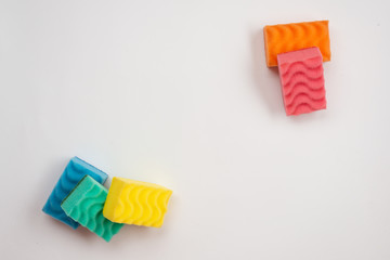 Colored sponges for washing dishes and other domestic needs.
