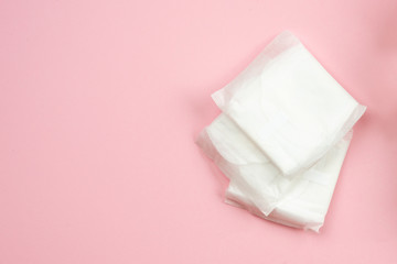 Woman pads lying on  pink  background. Woman hygiene protection (sanitary)