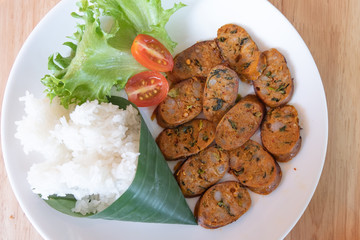 Sai Ua (Northern Thai Sausage) with Sticky Rice (Glutinous rice) Breakfast in Northern Thailand Served on table. Top View