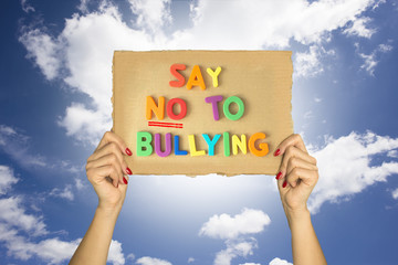 Say no to bullying text with hands holding a cardboard