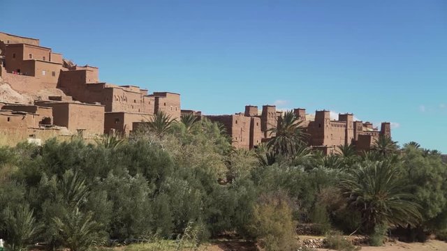 day shot panorama of Unesco historic village at Morocco ,Africa Ksar of Ait-Ben-Haddou  traditional architecture  sand city , heritage  benhadu  palm trees