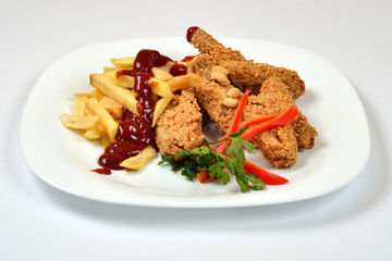 Food from a chicken restaurant with vegetables and sauce.
