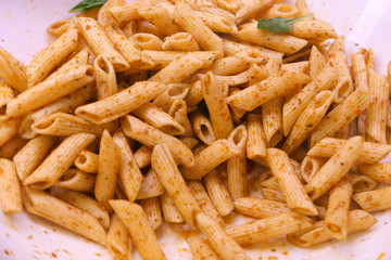 cooked pasta in a plate for dinner, close up