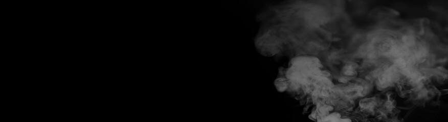 White smoke on a black background. Texture of smoke. Clubs of white smoke on a dark background for...