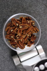 Weighing Pecan Nuts on Kitchen Scale. Making Chocolate, Pear and Pecan Pie Series.