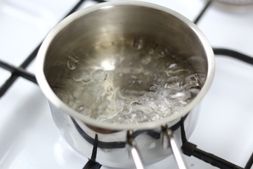 Boiling water in saucepan. Making Chocolate, Pear and Pecan Pie Series.
