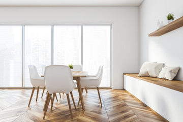 White panoramic dining room with bench