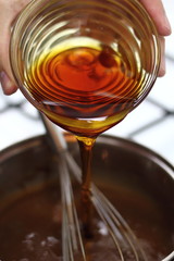 Pouring golden syrup into chocolate mixture. Making Chocolate, Pear and Pecan Pie Series.