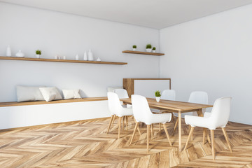 White dining room corner with cabinet