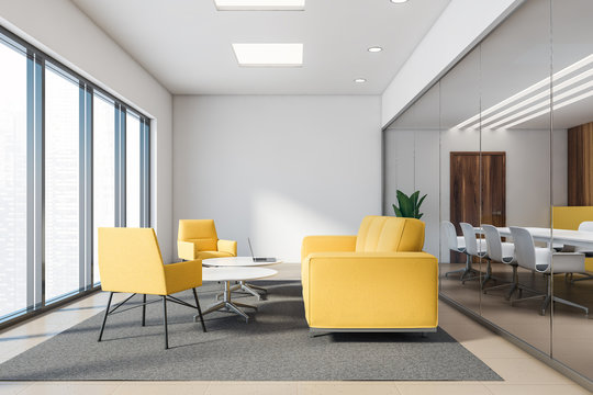 Yellow and wood office lounge with yellow sofas