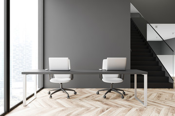 Gray panoramic office interior with stairs