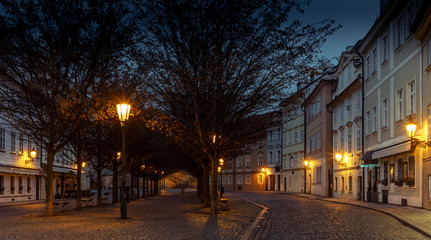 Fototapeta na wymiar A quiet old cobbled square in Prague during the early morning