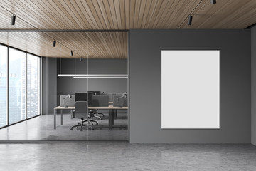 Gray open space office with poster
