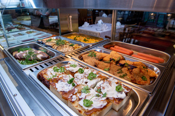 Restaurant breakfast menu with various cakes.