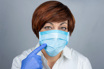 Woman in a medical mask. Protection against viruses, diseases. Viruses.