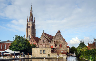 Fototapeta premium Last light of sunset on the buildings on canals in center of Bruges, Belgium