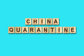 Quarantine. The inscription on wooden blocks on a blue background. Viruses. Epidemic.