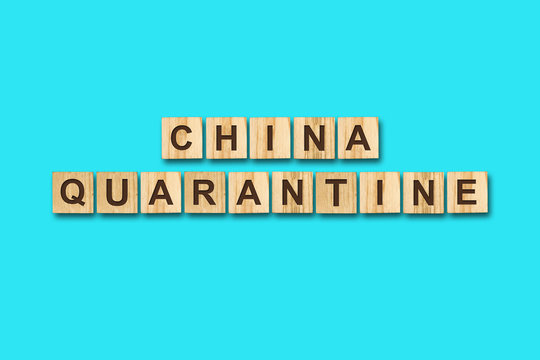 Quarantine. The inscription on wooden blocks on a blue background. Viruses. Epidemic.
