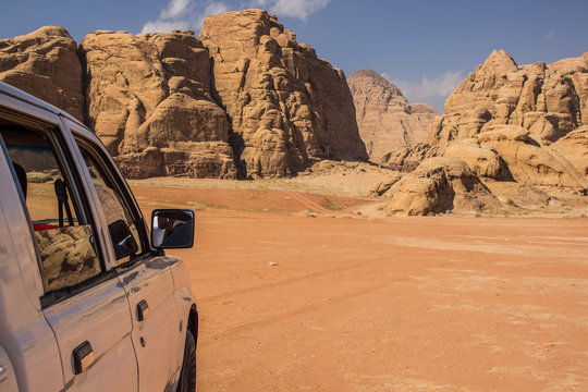 travel tour by car in Wadi Rum Easter desert landscape dry scenic nature environment picturesque rocky mountains background travel life style concept picture