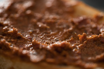 Closeup ciabatta with red pesto sauce