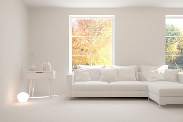 Stylish room in white color with sofa and autumn landscape in window. Scandinavian interior design. 3D illustration