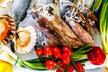 White-headed sea fish, shrimp, crabs, crayfish, mollusks, lobsters are on ice