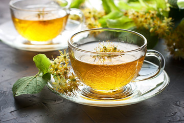 Linden herbal tea in  glass cup. Аlternative medicine сoncept