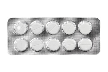 Pills in white blister pack isolated on white background. Global pharmaceutical industry. Closeup,...
