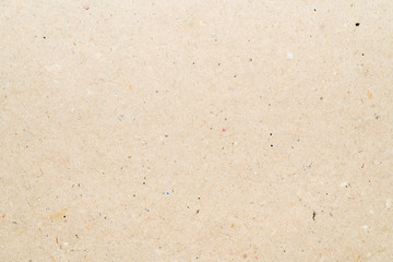 Light yellow texture from sheet of recycled cardboard. Close-up detail macro photography view of abstract background recycled eco-friendly carton material pattern background.