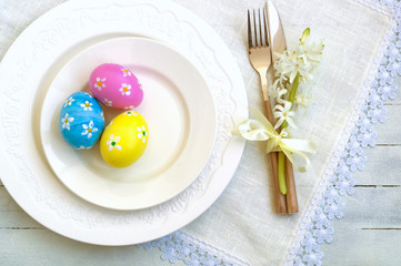 Elegant empty white plate, cutlery on linen napkin