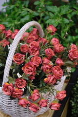 bouquet of red roses in a basket