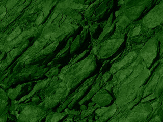 Green stone background. Green yellow grunge background. Toned texture of stones in the mountains with moss and mold. Decorative natural background with copy space for your design.