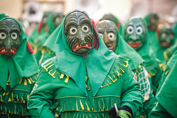 Festival participants dressed up in handmade costume and mask at the Ulmzug carnival event in Ulm,...