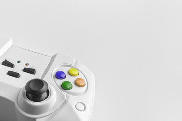 White wireless gamepad for playing video games. Joystick on a white background. Game controller...
