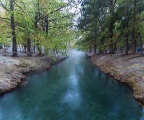 thermal water river, photo of morning fog over a lake in cold autumn weather in half moon san luis potosi