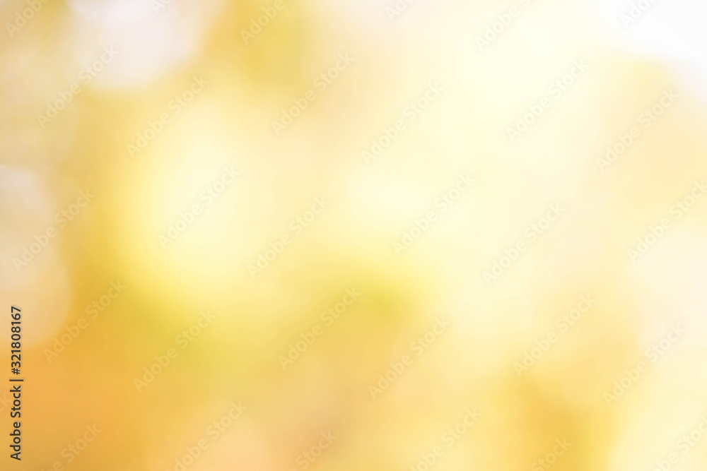 Wall mural yellow and orange color abstract bacground withe blurred defocus bokeh light for template