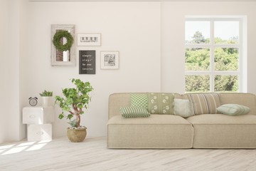 Stylish room in white color with sofa and summer landscape in window. Scandinavian interior design. 3D illustration
