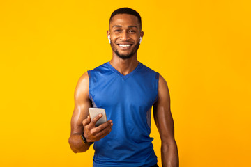 Portrait of handsome athletic black man with headphone