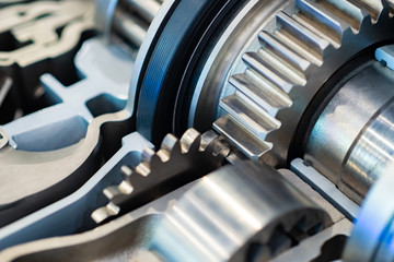 Industrial background. Concept - machine technology. Gears made of metal. Production of parts from...