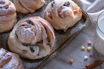 Kraffins with raisins and dried apricots, sprinkled with powdered sugar on top. Festive mood.