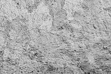 Texture of a concrete wall with cracks and scratches which can be used as a background