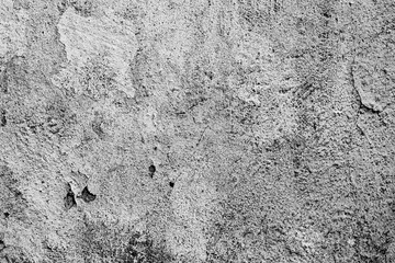 Texture of a concrete wall with cracks and scratches which can be used as a background