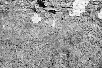 Texture of a concrete wall with cracks and scratches which can be used as a background