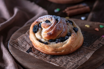 Kraffins with raisins and dried apricots, sprinkled with powdered sugar on top. Festive mood.