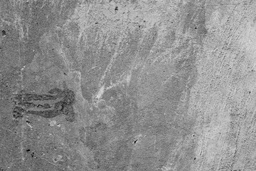 Texture of a concrete wall with cracks and scratches which can be used as a background