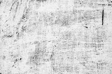 Obraz premium Tekstura ściany betonowej z pęknięciami i zadrapaniami, które mogą służyć jako tło