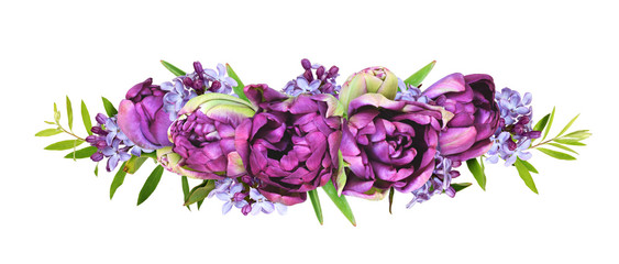 Purple peony tulips and lilac flowers in a floral arrangement