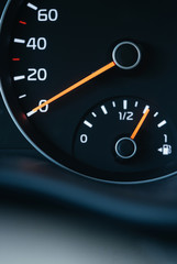 Car speedometer close-up macro. Fuel gauge with full tank.